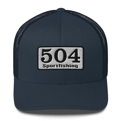A Navy trucker Cap with"504 Sportfishing" written on the front.