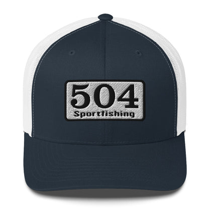 A Navy and White trucker Cap with"504 Sportfishing" written on the front.
